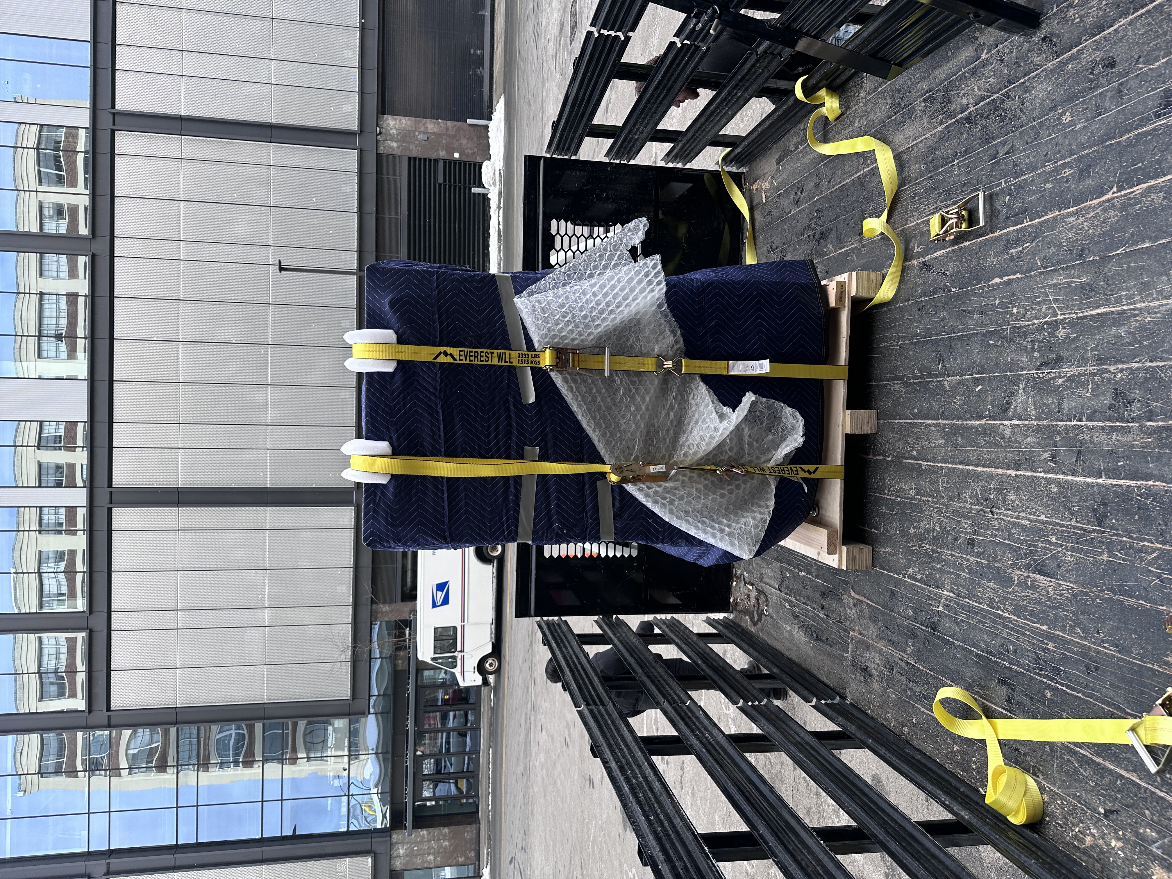 Associan secured to pallet at the loading dock, ready for freight