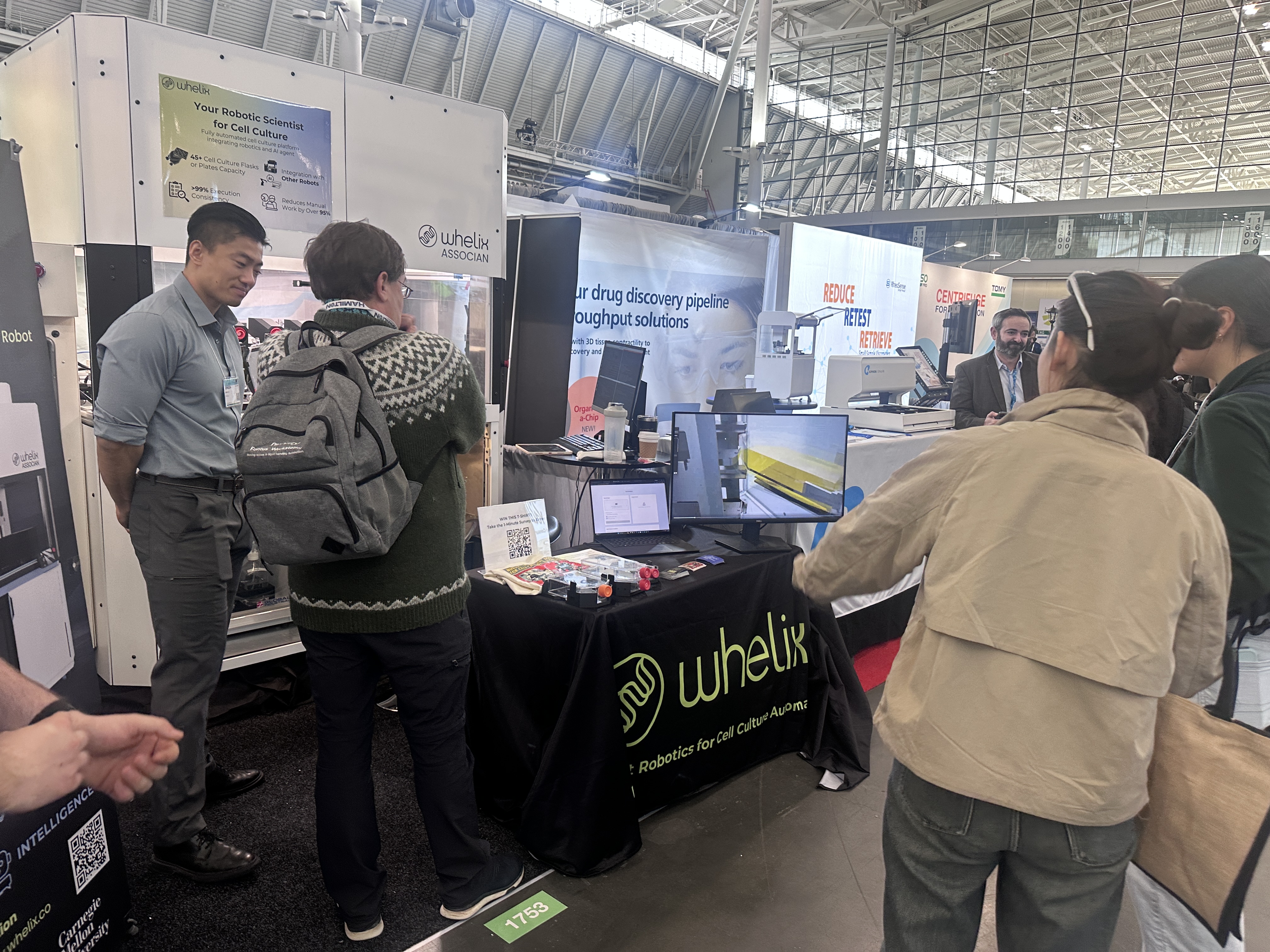 Active Whelix expo booth — visitors engaging with the live Associan demo