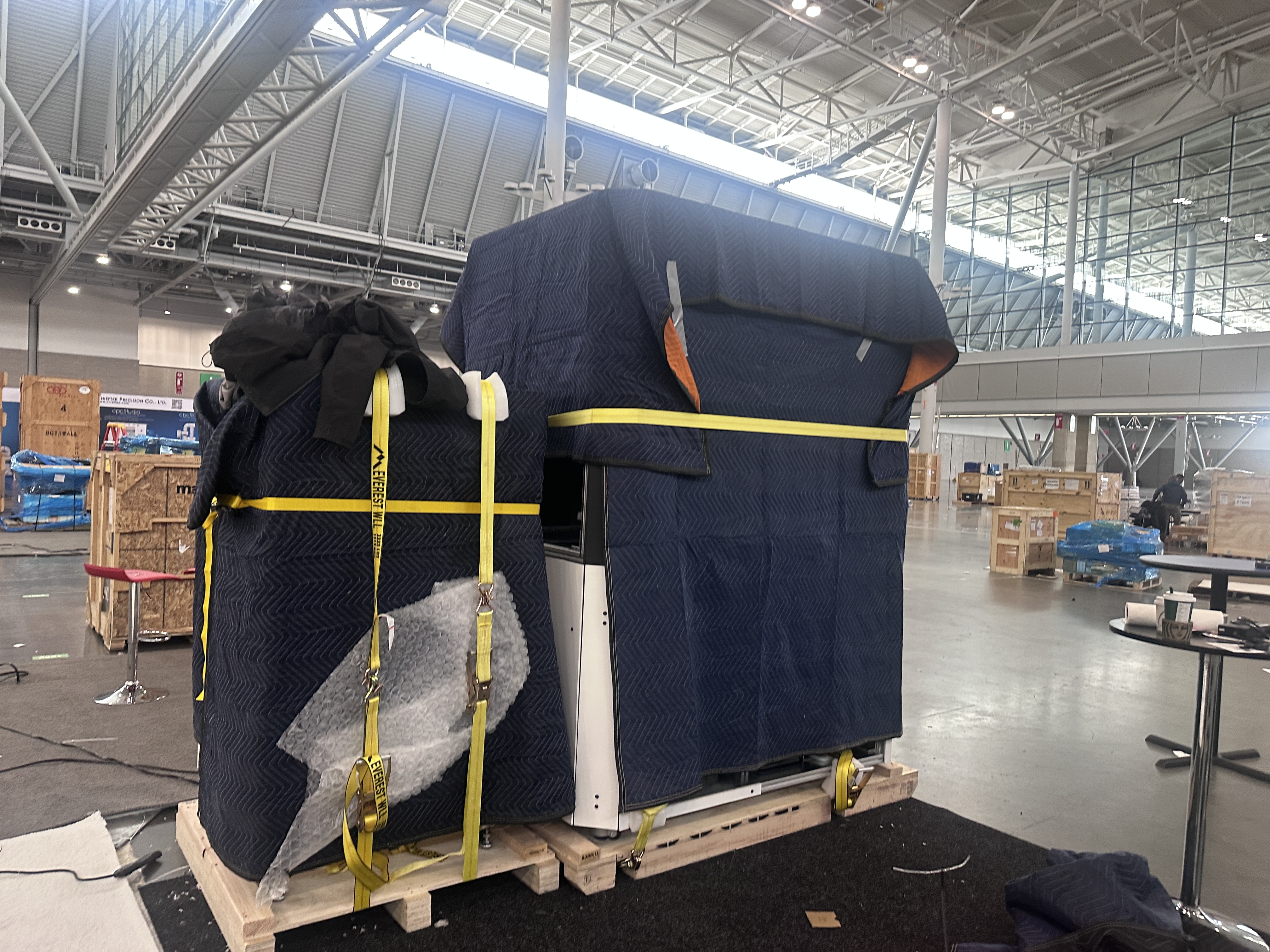 Associan wrapped and strapped to pallet in the empty expo hall